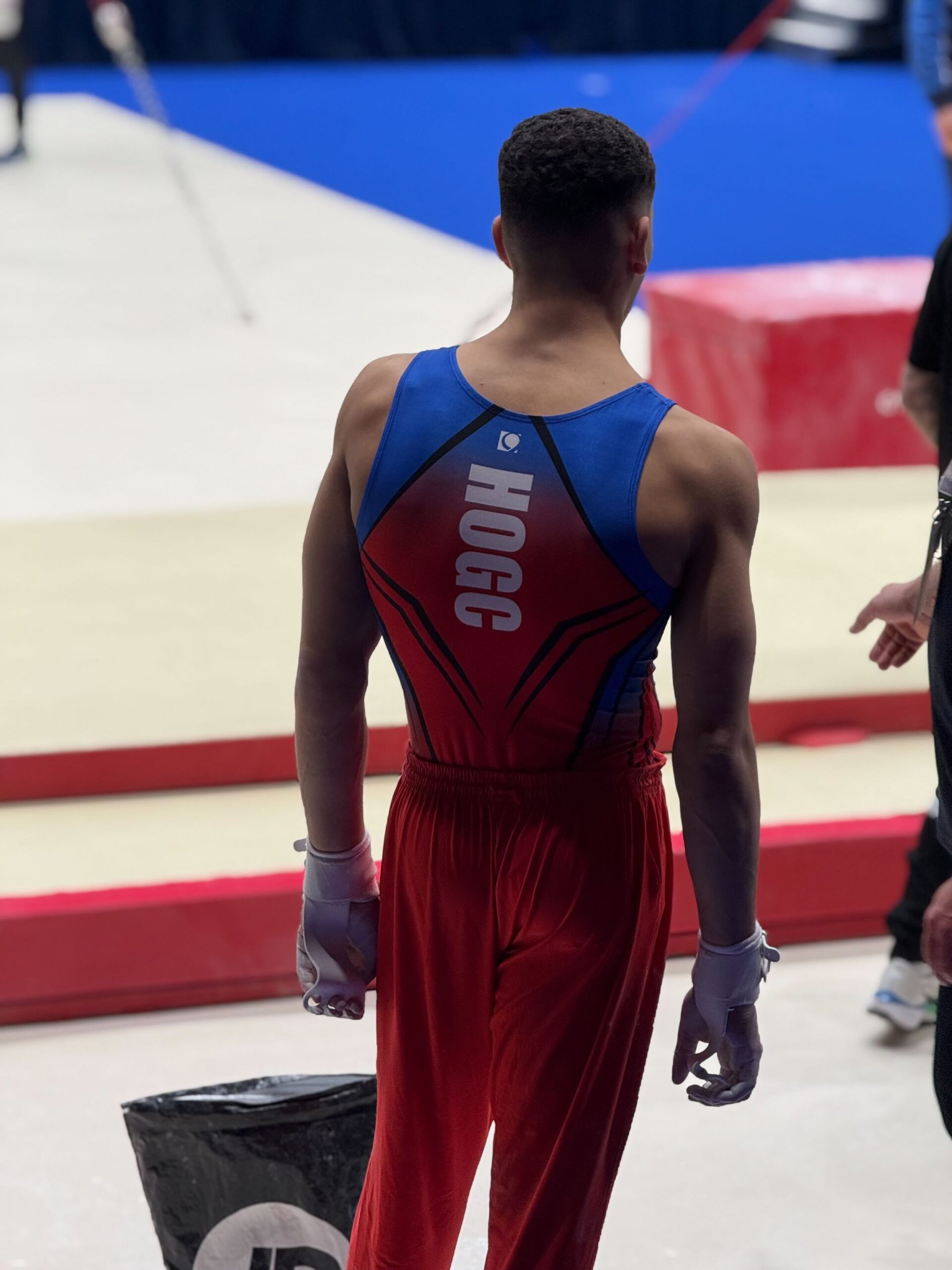 Sol Scott waiting for the high bar at the 2025 Biritsh Gymnastics championships